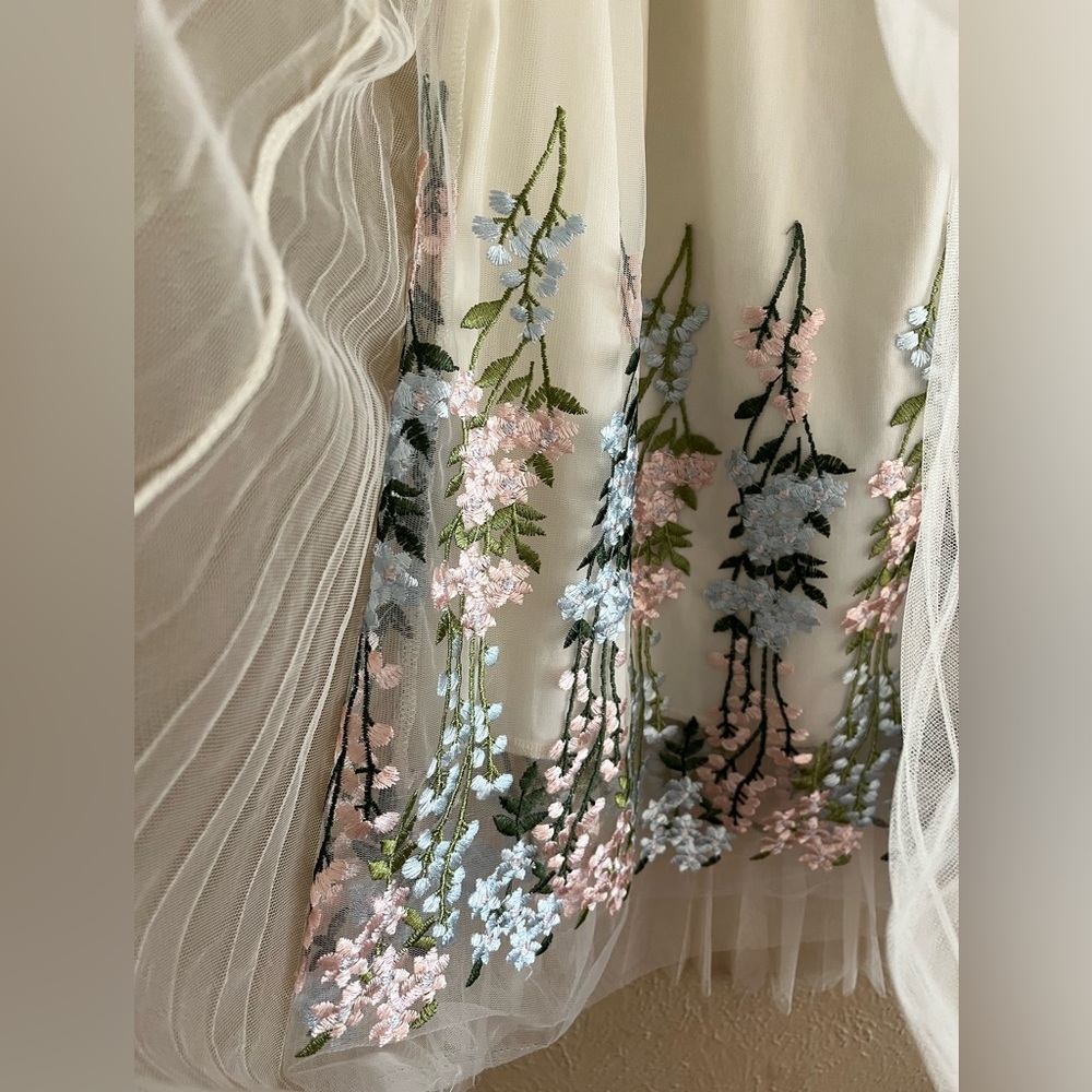 Beautiful floral, shear skirt, size M/L or a size 10 from Moon collection.